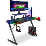 XTREME by O&S Carbon Fibre Effect Z Frame RGB PC Computer Gaming Desk with RGB LED Lights, Monitor Screen Stand, Desktop Tower Stand Trolley, Cable Management, Headset Hook & Drinks Cup Holder, Black